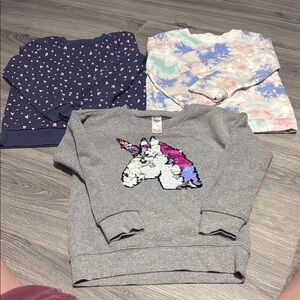 Blue and Gray Sweaters with Unique Designs**